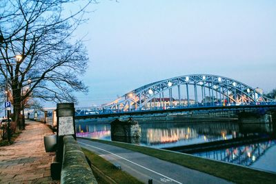 View of bridge in city against sky