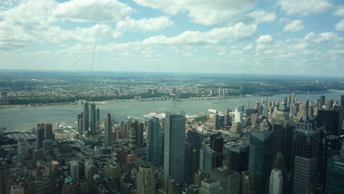 Aerial view of modern buildings in city against sky