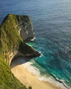 High angle view of sea by cliff