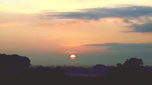Scenic view of silhouette landscape against sky during sunset