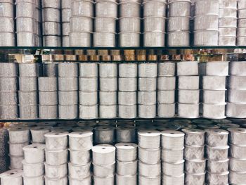 Full frame shot of rolls on shelves at factory