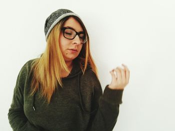 Portrait of beautiful young woman over white background