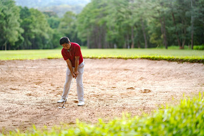 Full length of man playing on field