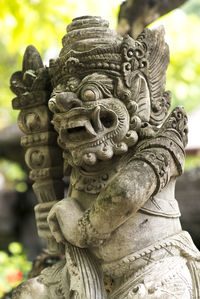 Close-up of angel statue at temple