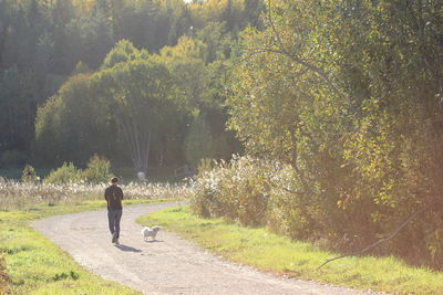 Full length of woman walking on grass