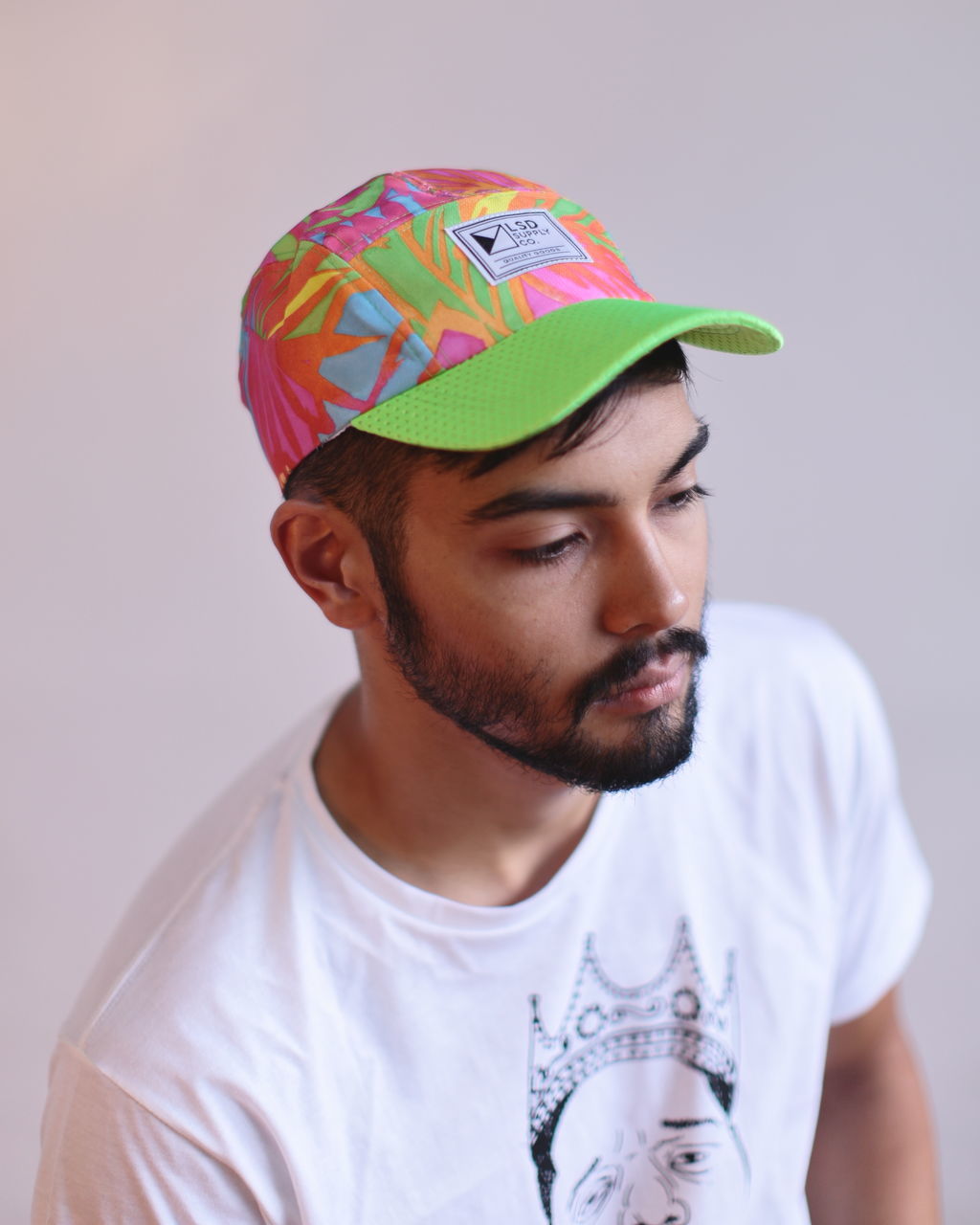 indoors, headshot, front view, multi colored, studio shot, contemplation, person, human face, white background, looking, facial expression, handsome