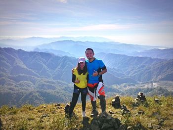 Hikers standing on mountain