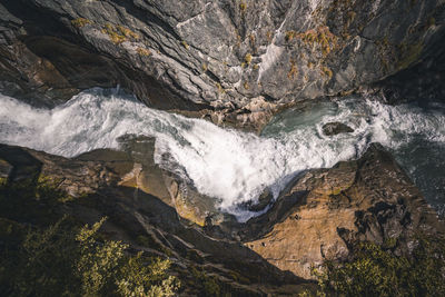 Directly above shot of stream amidst rocks