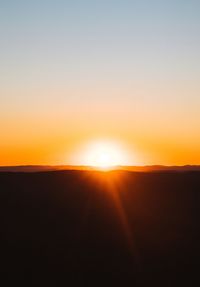 Scenic view of silhouette landscape against sky during sunset