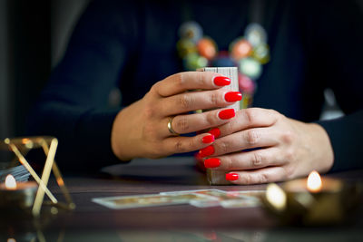 Midsection of man playing with toy blocks on table