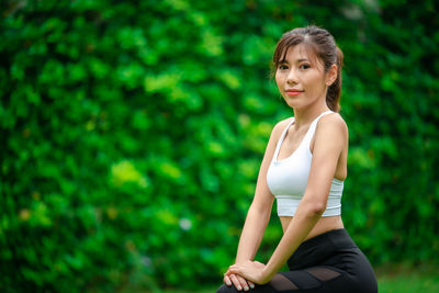 Portrait of woman sitting outdoors