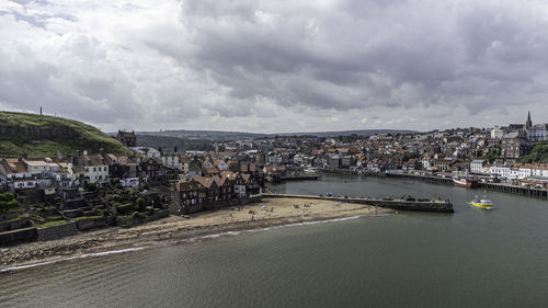 Drone shot of whitby east pier bay

