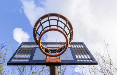 Low angle view of basketball hoop against sky