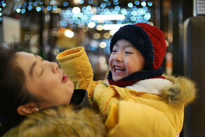 Smiling mother and son during winter