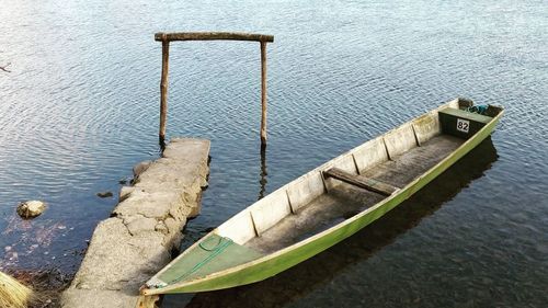 High angle view of railing by lake