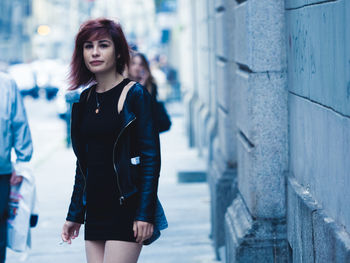 Woman smoking a cigarette on street