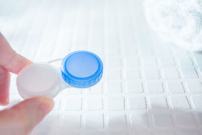 High angle view of person holding eyeglasses