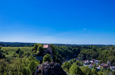 Panoramic view of landscape against clear blue sky