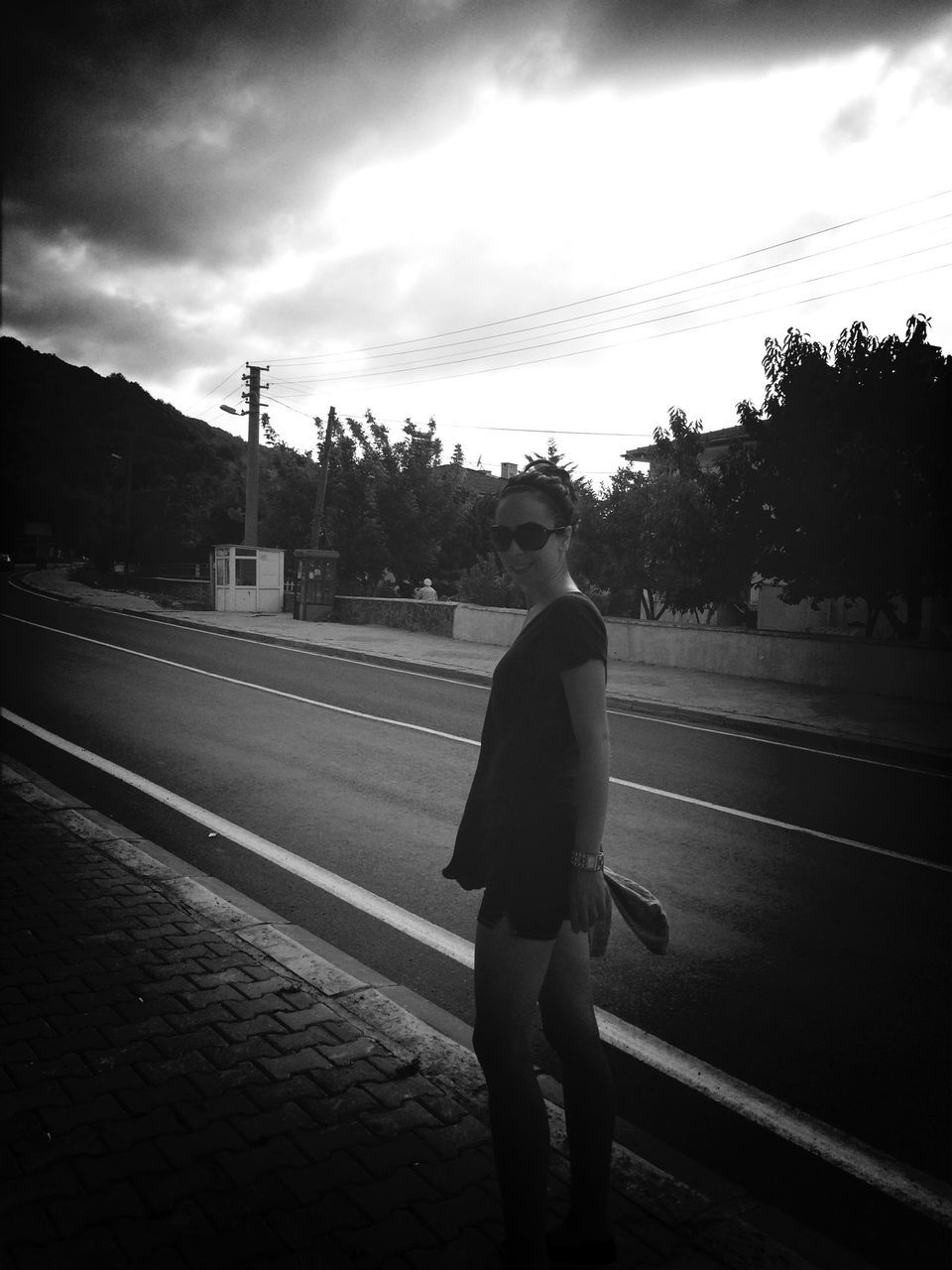 sky, lifestyles, casual clothing, full length, leisure activity, street, road, young adult, standing, person, transportation, tree, cloud - sky, outdoors, front view, rear view, young women, side view