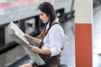 Young woman using digital tablet