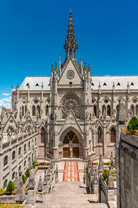 Low angle view of historic building against clear blue sky