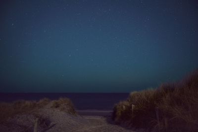 Scenic view of sea against sky at night