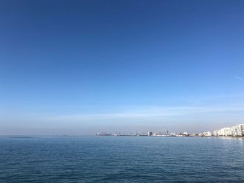 Scenic view of sea against clear blue sky