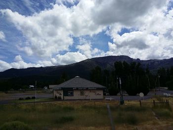 Scenic view of mountains against cloudy sky