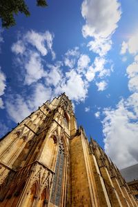 Low angle view of cathedral against cloudy sky