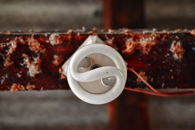 Close-up of cup and spoon on metal