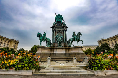 Low angle view of statue against cloudy sky