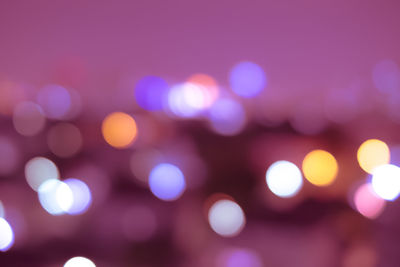 Defocused image of illuminated lights at night