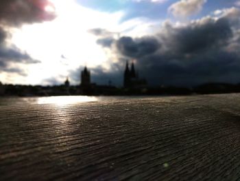Surface level of built structure against cloudy sky