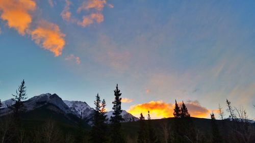 Scenic view of mountains against sky at sunset