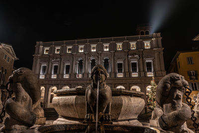 Statue of fountain at night