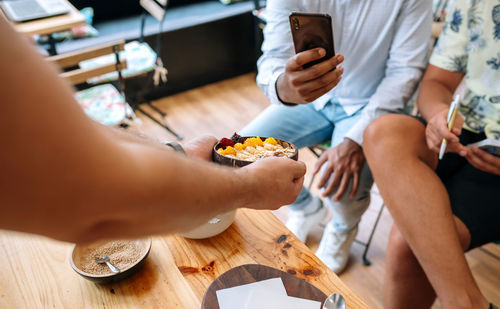 Midsection of woman preparing food on table