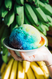 Close-up of hand holding ice cream