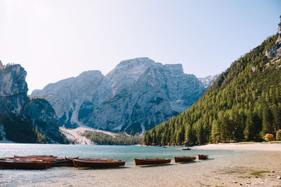 Scenic view of lake and mountains against clear sky