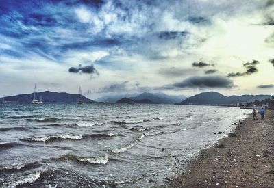 Scenic view of sea against cloudy sky