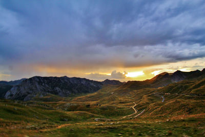 Scenic view of mountains against dramatic sky