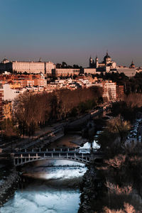 View of bridge over river in city