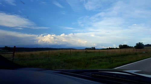 Scenic view of country road against sky