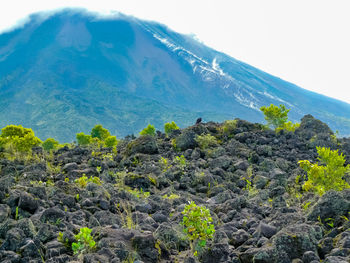 Scenic view of volcanic landscape against sky