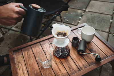 Barista dripping coffee and slow coffee bar style