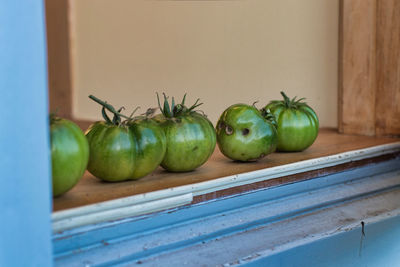 Close-up of green fruits on table