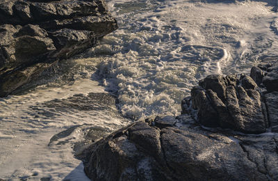 High angle view of rocks in water