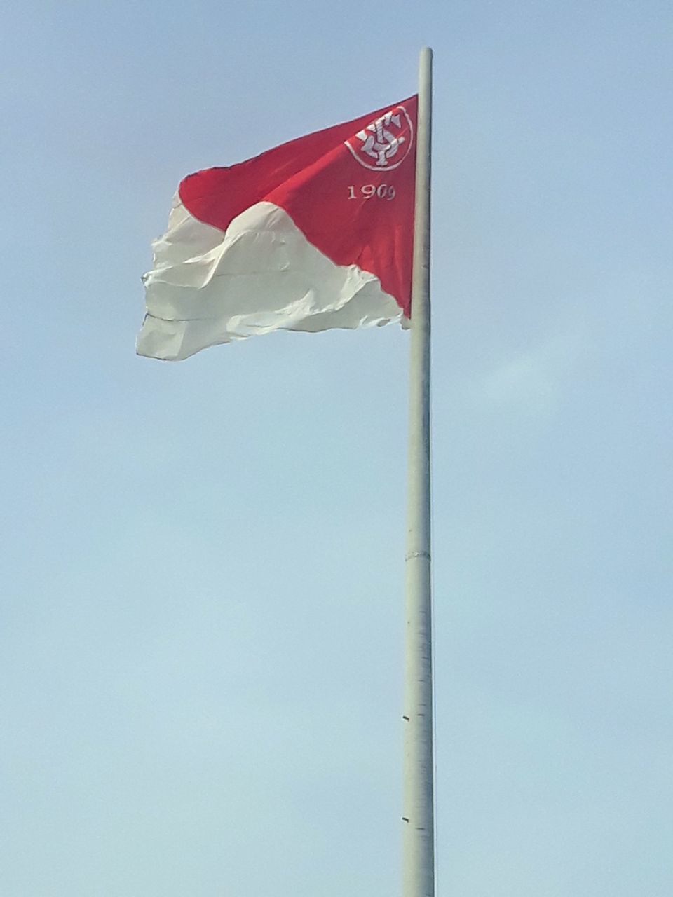 LOW ANGLE VIEW OF FLAGS AGAINST SKY