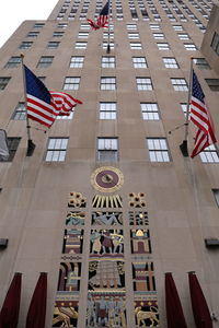 Low angle view of flags in building