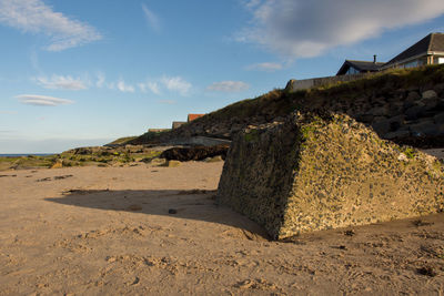 Scenic view of sand against sky