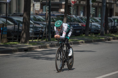 Man riding bicycle on road